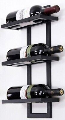 three bottles of wine are sitting on the wall