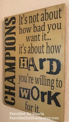 a wooden sign that says it's not about how bad you want it, it's about how hard you're telling to work for it