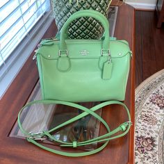 This Bag Is A Beautiful Spring Green Color And Has Absolutely Never Been Used!! 100% Authentic. The Detachable Handle Has A Maximum 26” Drop & Could Also Be Made Shorter. Beautiful Silver Hardware. Can Be Used All Spring & Summer. A Sassy Little Bag For Evening Outings Using The Satchel Handles Or A Cute Little Crossbody When You Are On The Go. The Original Price Is $250. All Offers Will Be Considered. Classic Green Satchel With Branded Hardware, Green Rectangular Satchel With Branded Hardware, Rectangular Green Satchel With Branded Hardware, Green Satchel With Branded Hardware For Daily Use, Daily Use Green Satchel With Branded Hardware, Coach Designer Green Bag, Green Coach Designer Bag, Designer Green Coach Bag, Green Coach Satchel With Top Carry Handle