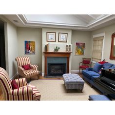 a living room filled with furniture and a fire place