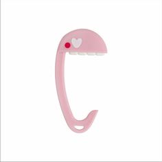 a pink toothbrush holder with a heart on it's side and the handle is shaped like an umbrella