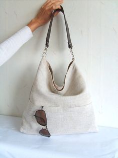 Linen tote bag Hobo tote bag natural linen color bag with | #bagsandpurses #linenbag #totebag #giftsforher Versatile Canvas Crossbody Hobo Bag, Trendy Canvas Hobo Bag In Tote Shape, Trendy Canvas Hobo Tote Bag, Canvas Hobo Bag With Pockets For Errands, Versatile Everyday Hobo Bag With Zipper Pocket, Everyday Bucket Bag With Double Handle And Pockets, Everyday Double Handle Hobo Bag With Pockets, Canvas Crossbody Hobo Bag, Beige Hobo Bag With Zipper Pocket For Travel