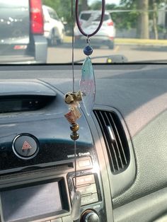 a car dashboard with an air vent hanging from it's side