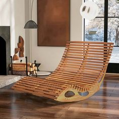 a wooden lounge chair sitting on top of a hard wood floor