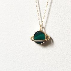 This sweet pendant is made using a saturn setting that I handmade and had cast in brass, which is then plated in shiny 14k gold. A beautiful  banded green malachite is set in the center, and it hangs on an 18" 14k gold-filled chain. Perfect for that space loving gal. Also available with a lapis, abalone, opal/turquoise/copper mash up, moonstone, or turquoise. Handmade 14k Gold-filled Round Necklaces, Green Oval Pendant Jewelry Nickel Free, Nickel-free Green Oval Pendant Jewelry, Nickel-free Green Oval Necklace, Green Nickel-free Oval Pendant Jewelry, Green Oval Nickel-free Necklace, Green Recycled Gold Jewelry For May Birthstone, Green Birthstone Jewelry In Recycled Gold, Oval Green Brass Jewelry