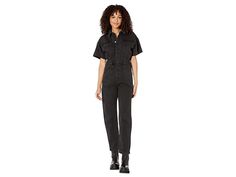 Free People Marci Jumpsuit - Women's Jumpsuit & Rompers One Piece : Iron Black : Exude a bold persona by wearing the classy Free People Marci Jumpsuit. Relaxed silhouette. Soft, semi-stretchable denim fabric. Pull-on style. Versatile coverall with classic spread collar and short sleeves. Defined elasticized waistband to enhance the shape. Center-front button closure. Two patch pockets on the front. 100% cotton. Machine washable. Imported. Measurements: Chest: 21 in. Waist: 15 in. Inseam: 28½ in. Trendy Relaxed Fit Short Sleeve Overalls, Short Sleeve Denim Utility Jumpsuit For Workwear, Utility Style Denim Jumpsuit With Short Sleeves For Work, Short Sleeve Cotton Overalls For Workwear, Cotton Short Sleeve Overalls For Workwear, Casual Short Sleeve Overalls For Workwear, Casual Workwear Overalls With Short Sleeves, Casual Overalls For Workwear, Short Sleeve Stretch Jumpsuits And Rompers With Pockets