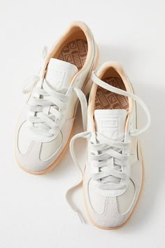 An 80s style returns in full force: these slim, tapered sneakers from Puma feature sleek leather uppers with a t-toe suede inlay and gum rubber outsole. **Features:** Low-top style, leather uppers, suede t-toe insert, side-stripe detail, logo tag, gum rubber outsole, lace-up closure **Why We | Puma Palermo Sneakers at Free People in Warm White/Alpine Snow, Size: US 9 Womens Everyday Shoes Sneakers, Cute Pumas Shoes, Suede Tennis Shoes, Low Top Shoes Women, Sneaker Skirt Outfits Women, Fall 2024 Sneaker Trends Women, Business Casual Outfits For Women Shoes, Shoes Like Sambas, Free People Sneakers