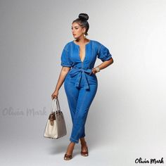 Olivia Mark - Blue Denim Jumpsuit with Stylish Design and Washed Finish Denim Blue V-neck Jumpsuits And Rompers, Blue Denim Overall Jumpsuit For Spring, Chic Blue V-neck Denim Jumpsuit, Spring Blue Denim Jumpsuits And Rompers, Trendy Blue Denim Jumpsuit With V-neck, Fitted Blue Denim Jumpsuit With V-neck, Trendy Blue Denim Jumpsuit For Day Out, Trendy Blue V-neck Denim Jumpsuit, Blue Denim Jumpsuit For Spring