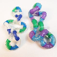 three plastic teethpaste rings sitting next to each other