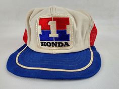 Up for auction, pre-owned vintage Honda Number One Team Racing Adjustable Trucker Hat by Hondaline.  PLEASE NOTE: Item is in Good condition, with signs of age. Looks barely worn. No holes or tears. Inside looks clean but foam seems fragile from age, snaps in good shape. Brim is misshaped, material is not super sturdy. Fits 6 7/8 to 7 1/2. May be lightly dusty in spots, color slightly faded, maybe some fuzz from storage. Please review all photos above before bidding, any questions please ask, tha Men Drip, Vintage Motocross, Street Fashion Men Streetwear, Accessories Ideas, Pink Flamingo, One Team, Pink Flamingos, Mens Streetwear, Adjustable Hat