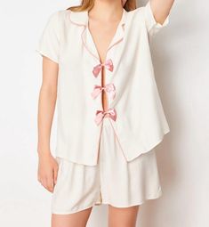 🌙 Slip into comfort with our White Pajama Set featuring an adorable Pink Bow 🎀. Perfect for a cozy night's sleep 🛌 or lounging around the house 🏠. Soft, breathable fabric ensures you stay comfortable all night long 🌟. Add a touch of elegance and fun to your nighttime routine with this charming set! 💕 Hello, Thank you for choosing to shop with us on Etsy! We appreciate your support and are thrilled to be able to provide you with unique and beautiful watches. We understand that keeping you informed about the shipping process is essential, so we want to assure you that we are committed to ensuring a smooth and timely delivery. Once your order is placed, our team works diligently to process it as quickly as possible. We carefully package each item to ensure its safety during transit. Onc Feminine White Sets For Sleepover, Feminine Pajama Shorts For Pajama Party, White Feminine Sleepwear For Relaxation, Cream Summer Sleep Sets, Feminine Summer Sleepover Sets, Feminine White Pajama Shorts For Pajama Party, White Short Set For Pajama Party, Pink Short Set For Sleep, Spring Pajama Party Short Set