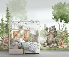 a child's room with a bear and deer mural on the wall next to a bed