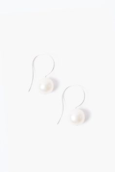 These elegant drop earrings features a white baroque pearl on sterling silver hooks. Pair it with the White Baroque Pearl Pendant Long Necklace to complete the look. Approx. 0.5" in length. Handmade in Vietnam. Elegant Jewelry With Fish Hook For Gift, Elegant Fish Hook Jewelry For Formal Occasions, Elegant Dangle Earrings With Fish Hook, White Pearl Pendant Earrings In Sterling Silver, Classic Pearl Earrings With French Hook, Elegant Teardrop Earrings With Fish Hook, Classic Silver Pearl Earrings With French Hook, Elegant Drop Earrings With Fish Hook, Classic Pearl Earrings With French Hook As Gift