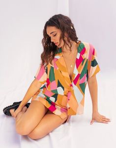 Stand out in style with this unique colorful button up blouse. Rayon Imported Casual Button-up Top With Vibrant Print, Multicolor V-neck Shirt With Button Closure, Vibrant V-neck Blouse For Day Out, Trendy V-neck Blouse With Vibrant Print, Multicolor V-neck Shirt For Summer, Retro V-neck Summer Blouse, Multicolor Collared Shirt With Vibrant Print, Colorful V-neck Blouse For Vacation, Multicolor Collared Shirt For Beach