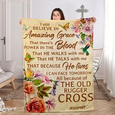 a woman is holding up a blanket with flowers on it and the words i can't believe in amazing grace