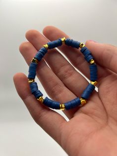 Clay bead bracelet with gold stars. Fits 6-inch wrist. Free shipping in US. Clay Bead Bracelet Ideas Aesthetic Blue, Pari Core, Clay Bead Bracelets For Boys, Clay Bead Bracelet Patterns, Clay Bead Inspo, Bracelet Clay, Beaded Bracelets For Men, Navy Bracelet, Clay Bead Bracelet Ideas