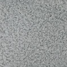 a close up view of the texture of a carpet with grey and white color scheme