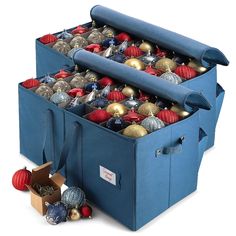 two blue storage bins filled with ornaments