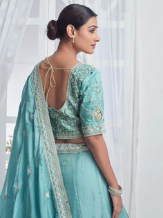 Introducing our precious sky-blue embroidered organza bridesmaid lehenga choli, a stunning ensemble that will make you stand out at any event or special occasion. This beautiful lehenga set features a sky-blue color organza lehenga with intricate multi-embroidered work and sequin detailing, paired with a matching choli and dupatta that also boasts beautiful embroidery and sequin work. The designer lace work on the dupatta adds an elegant touch to the overall look.
This lehenga choli set includes Unstitched Organza Lehenga For Reception, Blue Organza Sets With Dori Work, Floor-length Embroidered Organza Choli, Organza Unstitched Blouse For Wedding, Organza Traditional Wear With Unstitched Blouse For Wedding, Light Blue Unstitched Sets With Intricate Embroidery, Wedding Traditional Wear With Unstitched Organza Blouse, Blue Organza Anarkali Set With Dori Work, Embroidered Organza Lehenga For Eid