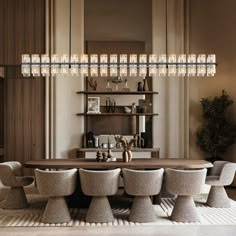 a dining room table with six chairs and a chandelier hanging from the ceiling