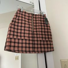 Pink, Brown, Tan Plaid High Waist Mini Skirt With Zipper 98% Cotton 2% Spandex Casual Mini Skort With Zipper Closure, Casual Mini Skirt With Zipper Closure, Casual Spring Skort With Zipper Closure, Casual Skort With Zipper Closure For Spring, Pink Skirt For Fall, Pink Casual Mini Skirt For Fall, Casual Pink Mini Skirt For Fall, Casual Denim Skirt With Zipper Closure, Pink Fall Skirt