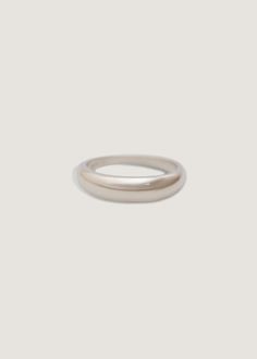 Inspired by Jennie's great grandmother's wedding band, this is a signature timeless piece you'll wear for every occasion. Her soft curves are bold, yet elegant enough to be worn day to night. Make her your trademark.Shop the 14k gold version HERE. We recommend sizing up by at least half a size if this ring is thicker than what you typically wear. Silver 925—rhodium platedWeight: Approx 3gThickness: 5mm thick (front), 2mm (back)We offer custom sizes upon request. You can add custom or half sizes Dare To Love, Love Dare, Initial Disc Necklace, The Dare, Hammered Rings, Plastic Ring, Dome Ring, Average Weight, Pearl Hoop Earrings