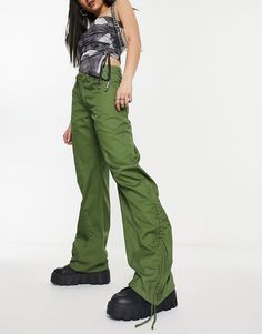 Pants by Motel Style refresh: pending Mid rise Belt loops Four pockets Wide leg Green Drawstring Bottoms For Streetwear, Green High-waisted Utility Cargo Pants, Green High-waisted Bottoms With Side Pockets, Green Wide-leg Cargo Parachute Pants, Green High-waisted Cargo Bottoms, Green Fitted Casual Parachute Pants, Fitted Green Cargo Style Bottoms, Fitted Green Cargo Bottoms, Green Wide-leg Bottoms With Drawstring