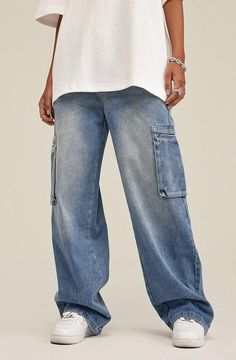 Embrace a laid-back vibe with these cargo jeans, characterized by a light wash denim that evokes a cool, relaxed aesthetic. The cotton construction ensures comfort, while the zip and button fastening provides ease of wear. Enhanced by two front, two back, and two side cargo pockets, this wide-leg pair is as practical as it is stylish. Light wash denim Men's jeans Zip & button fastening Cotton 2 front, 2 back and 2 side cargo pockets Wide leg Our model wears XL and is 5'8 (178cm) Baggy Cargo Jeans, Relaxed Aesthetic, Fall Sweaters For Women, Jogger Pants Casual, Denim Hoodie, Fashion Vibes, Streetwear Grunge, Corsets And Bustiers, Strapless Tops