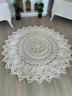 a white rug with an intricate design on the floor