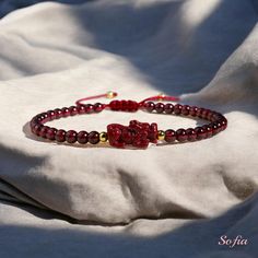 This red garnet dainty bracelet is fun and easy to wear and match with any outfit. They can express your style, mood, or personality in a subtle and charming way. It is perfect for anyone who loves minimalist style, natural stones. It is a unique and meaningful gift for yourself or someone special. You can wear it by itself or mix it with other bracelets for a fun and trendy look. If you have a large demand of the stone beads or bracelets, please feel free to contact us for details. - Material : Elegant Red Bracelets For Good Luck, Adjustable Spiritual Garnet Jewelry, Elegant Red Adjustable Braided Bracelets, Elegant Red Adjustable Braided Bracelet, Elegant Red Beaded Friendship Bracelets, Handmade Burgundy Bracelets As Gift, Adjustable Red Hand-strung Crystal Bracelet, Handmade Burgundy Bracelet As A Gift, Elegant Red Bracelets For Friendship