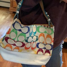 Gently Used Authentic Coach Scribble Handbag / Tote White With Multi Color “C” Pattern. The White Had Faded Over The Years To A Pale Yellow Tint A Few Small Scuff Marks At Bottom Of The Bag . I Have Included Pics Of That . Please Request More Pics If Needed . Impeccable Condition ! Dust Bag Included Vintage Coach, Medium Tote, Pale Yellow, New Vintage, Coach Bags, Womens Tote Bags, Yellow White, Tote Handbags, Like New