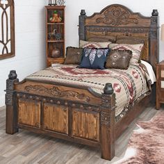 a bedroom with a bed, nightstands and other items on the wooden flooring