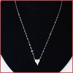 A slightly elongated sterling silver or gold vermeil heart, covered with extremely sparkly cubic zirconia pavé, hangs fixed on a unique and delicate sterling chain. The heart is 1/2" long and 3/8" wide. The chain is 14-16" long with extender and a lobster clasp. Available in silver or gold vermeil. Imported for the Leila Jewels Glam Collection. Silver Heart Necklace, Heart Necklace, Gold Vermeil, The Chain, Lobster Clasp, Silver Gold, Cubic Zirconia, Sterling Silver, Chain