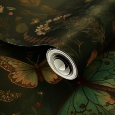 a close up view of a wallpaper with butterflies and flowers on the background,