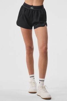 Make the match. The Match Point Short is a high-cut performance staple — made from lightweight woven fabric with a relaxed fit and built-in brief for comfortably pushing the limits at practice. An elastic logo waistband finishes off the look and an invisible side pocket stores small essentials on-the-go. Alo Shorts, Skater Outfit, Running Outfits, Sweater Knit Skirt, Teen Outfits, Match Point, Workout Sets, Yoga Shop, Back Women