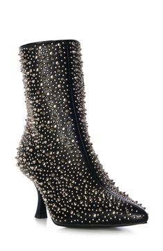 Polished studs create an edgy aesthetic on a bold bootie balanced by a pointy toe and tapered flare heel. Side zip closure Synthetic upper, lining and sole Imported Asian & Pacific Islander Owned/Founded Chic Pointed Toe Boots With Rhinestone Rivets, Punk Heels With Reinforced Heel For Fall, Punk Pointed Toe Heels For Fall, Punk Style Pointed Toe Heels For Fall, Trendy High Heel Boots With Rivets, Edgy Heeled Boots With Reinforced Heel For Fall, Trendy Studded Pointed Toe Heels, Fitted Pointed Toe Heels With Studs, Trendy Pointed Toe Heels With Studs