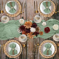 an overhead view of a table with place settings and flowers on it, along with napkins