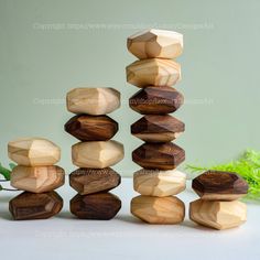 a stack of wooden blocks sitting on top of a table