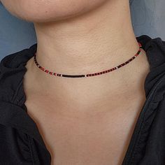 Unique choker necklace made with matte black, matte red Miyuki beads and 925 sterling silver beads. 925 sterling silver lobster claw clasp. This necklace is safe to wear in water.  See more seed bead necklaces at my store:  https://www.etsy.com/shop/FayFayJewelry?ref=dashboard-header&section_id=50377409 Visit my store for more unique handmade jewelry pieces: https://fayfayjewelry.etsy.com All jewelry pieces in this store are designed and handmade by myself. Please don't hesitate to reach out if you have any questions or requests! Adjustable Red Necklace With Black Beads, Minimalist Black Beads For Gifts, Minimalist Black Beads For Gift, Minimalist Black Beads As Gift, Minimalist Red Beaded Necklaces, Black Choker With Tiny Beads For Gift, Gift Black Choker With Tiny Beads, Minimalist Red Beaded Necklace, Red Minimalist Beaded Necklace With Tiny Beads