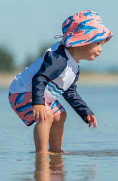 Baby will have a whale of a good time in the sun with this two-piece swimsuit featuring a long-sleeve rashguard paired with whale-print swim shorts. Shorts have drawstring waist UPF 50+ sun protection 82% polyester, 18% elastane Machine wash, line dry Imported White Swimwear For Ocean Activities And Beach Season, White Swimwear For Ocean Activities During Beach Season, Playful Swim Trunks For Ocean Activities, Upf 50+ Swimwear For Beach Season Playtime, White Rash Guard With Upf 50+ For Poolside, Playful Swimwear With Uv Protection For Ocean Activities, Spring White Rash Guard For Swimming, Spring Rash Guard In White For Swimming, White Upf 50+ Rash Guard For Poolside