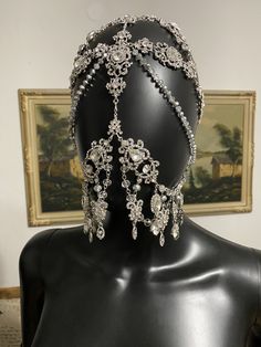 Rhinestone Silver headpiece Silver crystal Veil A silver crystal chain veil that would be perfect for weddings and festivals This gorgeous face mask is designed with clear rhinestones, and a silver chain. You will be the center of attention with these sparkling jewels at a party or to your wedding! This crystal it looks amazing under stage lights. Crystal Veil, Silver Headpiece, Veil Crystal, Silver Mask, Chain Mask, Rhinestone Headpiece, Silver Head Piece, Mask Fashion, Crystal Headpiece