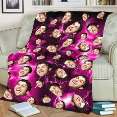 a blanket with the faces of two men on it, and lightning in the background