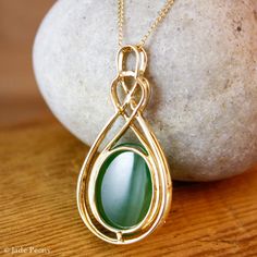 "Here is a beautiful translucent large oval green nephrite jade pendant set with pave diamonds in solid 18KT yellow gold. The jade is set in a double infinity love knott halo setting and is surrounded by pave set round diamonds. The jade is about 14x18mm and is approx. 14.45 carats. The total weight of the brilliant cut round white diamonds is 0.49 carats. The pendant is about 1 1/2\" long. The chain is 14KT gold and is 16\" long. If you do not want the chain, please convo us and we will adjust Elegant Oval Jade Jewelry, Elegant Oval Cabochon Jade Jewelry, Double Infinity, Infinity Love, Lucky Green, Nephrite Jade, Halo Setting, Wedding Necklaces, Jade Pendant