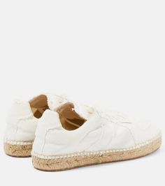 A combination of designs, these canvas sneakers from Maison Margiela are set on espadrille-style woven soles and have classic lace-up fastenings..Closure: lace-up.Lining: fabric.Sole: fabric insole, rubber sole.Toe shape: round toe.Trim: jute.Upper: fabric.comes with dust bags.comes with a box.Made in Spain.Fits large to size - we recommend trying one size smaller.European sizes.2cm-1' platform (size EU 38) Cream Lace-up Sneakers For Summer, Textile Lace-up Canvas Shoes With Contrast Sole, Textile Canvas Shoes With Contrast Sole, Textile Lace-up Sneakers With Woven Sole, Beach Sneakers With Textured Sole And Lace-up Design, Beach Lace-up Sneakers With Textured Sole, Beige Sneakers With Contrast Sole For Summer, Beige Low-top Sneakers With Woven Sole, Summer Beige Sneakers With Contrast Sole