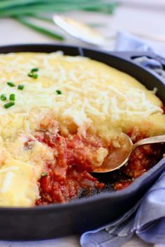 a casserole dish with meat and cheese in it, ready to be eaten