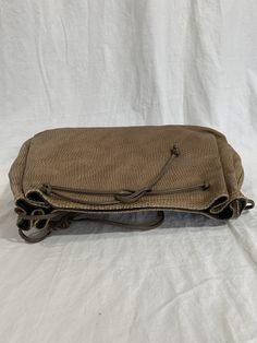 "Measurements are 12\"5 wide, 8\"3 high, 3\" deep with a 40\" shoulder strap. On the interior there is one main compartment with a back zipper pocket, lined in vinyl with a top magnetic closure. Bag is made of tan leather with taupe trim and front patches. Some light scuffs and some marks with no tears or holes and bag can be used crossbody. 100% genuine Carlos Falchi made in USA. I WANT TO STRESS THAT THIS ITEM IS VINTAGE WHICH MEANS IT'S NOT NEW. IF YOU'RE LOOKING FOR A NEW BAG PLEASE DON'T BI Taupe Trim, Taupe Leather, Purse Crossbody, No Tears, New Bag, Magnetic Closure, Tan Leather, Purses Crossbody, Leather Shoulder Bag