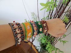 Fully handcrafted embroidered bracelet. Decorated with tiny pieces of mirrors. This product has been made by Balochi women. The art of Balochi embroidery and its pattern is very unique and has been preserved by women in Balochi tribes. Ordering this product empowers Balochi women. Please contact me if you want to order more than 5 items. Folk Style Handmade Jewelry As Gift, Handmade Folk Jewelry As Gift, Handmade Folk Style Jewelry For Gifts, Handmade Folk Style Jewelry Gift, Handmade Friendship Bracelets For Festivals As Gift, Traditional Green Friendship Bracelets, Handwork Bracelets For Festivals, Traditional Embroidered Bangle Jewelry, Handwork Bangle Bracelets For Festivals