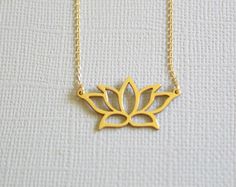 ✔️The most unique jewelry you can find, a perfect gift for you and your loved one. PRODUCT OVERVIEW Lotus Plant Gold Sterling Silver Charm Necklace Pendant Weight 0.096 oz (0.84g), Length 14.1mm (0.55 in) and Width 26.6mm (1.05 in)  It fits 41cm-46cm (16.1 inches to 18.1 inches) Adjustable Chain  Good for sensitive skin  Makes a great gift for any Anniversary, Engagement, Wedding, Birthday, Holiday, Promise, Graduation, Valentine's, or Special Occasion! LOTUS:  The meanings of the lotus flower, this plant is known to be associated with rebirth. This magnificent flower emerges from the dirty and unclean bottom of a pond but still remains untouched and unstained by the dirt and mud surrounding it in the pond. This unique quality of the flower is believed to represent the pure spirit, rebirth Small Minimalist Necklace As A Gift, Small Minimalist Necklace Perfect For Gifts, Minimalist Small Necklace Perfect For Gifts, Small Minimalist Necklace For Gift, Gold Jewelry With 16 Inch Chain As Gift, Delicate Jewelry For Gifts, Delicate Small Jewelry Gift, Small Jewelry For Mother's Day Gift, Small Mother's Day Jewelry Gift