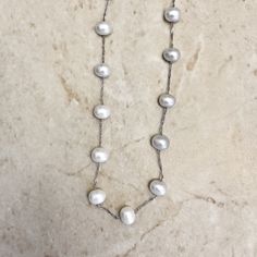 14 karat white gold Tin-Cup-Pearl necklace featuring 23 genuine potato freshwater pink pearls measuring approximately 6-6.5 mm. Weighs 0.70 gram. L: Chain is 18 inches long. Birthstone: June. Condition: Excellent, Brand New. - 14 day return policy, no questions asked. - Free insured shipping in the US. - International shipping available. Visit our website for more details about our company: www.weiljewelry.com Silver Oval Necklace For Birthday, Classic White Birthstone Necklaces, Anniversary Pearl Chain Jewelry, White Pearl Chain Jewelry For Birthday, White Oval Necklace For Anniversary, White Oval Necklaces For Anniversary, Silver Pearl Necklace With 17 Jewels For Anniversary, White Pearl Pendant Necklace For Birthday, White Pearl Pendant Necklace For Birthdays