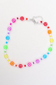 Rainbow smiley necklace with adjustable length Cheap Adjustable Rainbow Jewelry, Cheap Rainbow Beaded Necklaces With Letter Beads, Cheap Rainbow Necklace With Large Beads, Trendy Necklaces For Friendship, Trendy Adjustable Necklace For Friendship, Casual Adjustable Length Choker Necklace, Adjustable Fun Necklace With Round Beads, Casual Smiley Face Jewelry For Gifts, Cute Charm Necklaces With Adjustable Chain